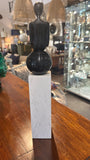 Long Legged Person on Marble Column Figurine