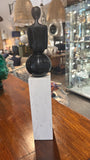 Long Legged Person on Marble Column Figurine